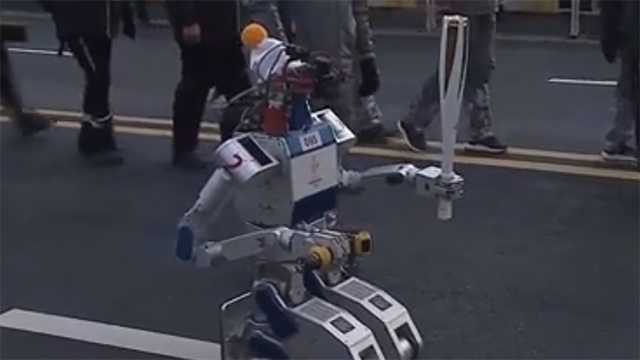 Robot carries Olympic torch