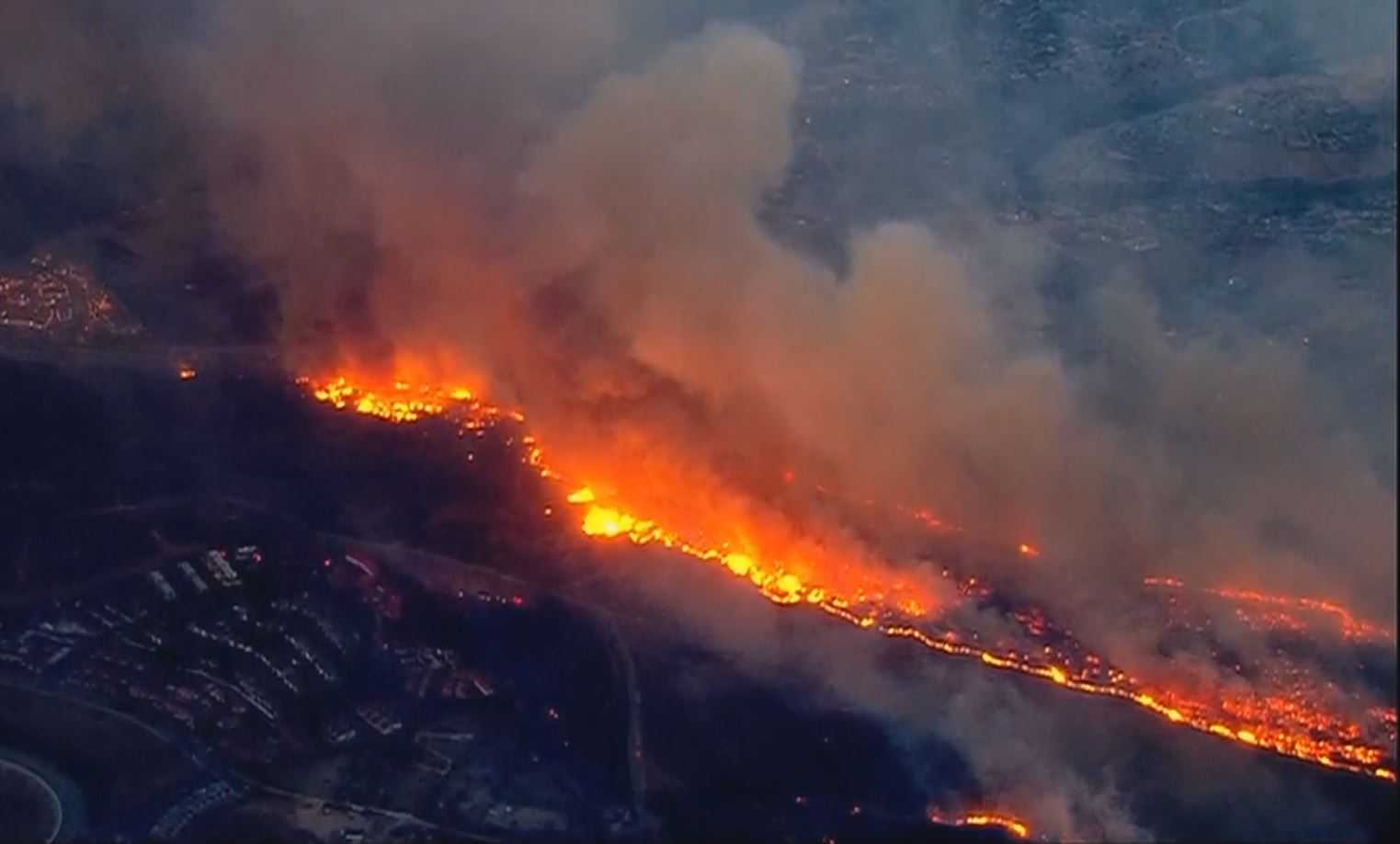 Fast-moving flames force evacuations in Southern California