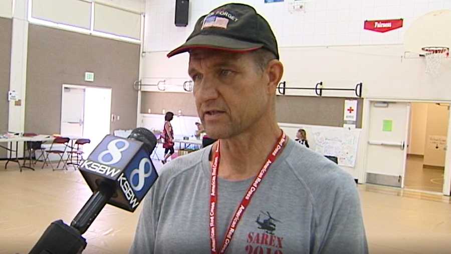 image of school teacher/reserve police officer Dennis Alexander being interviewed in a school classroom.