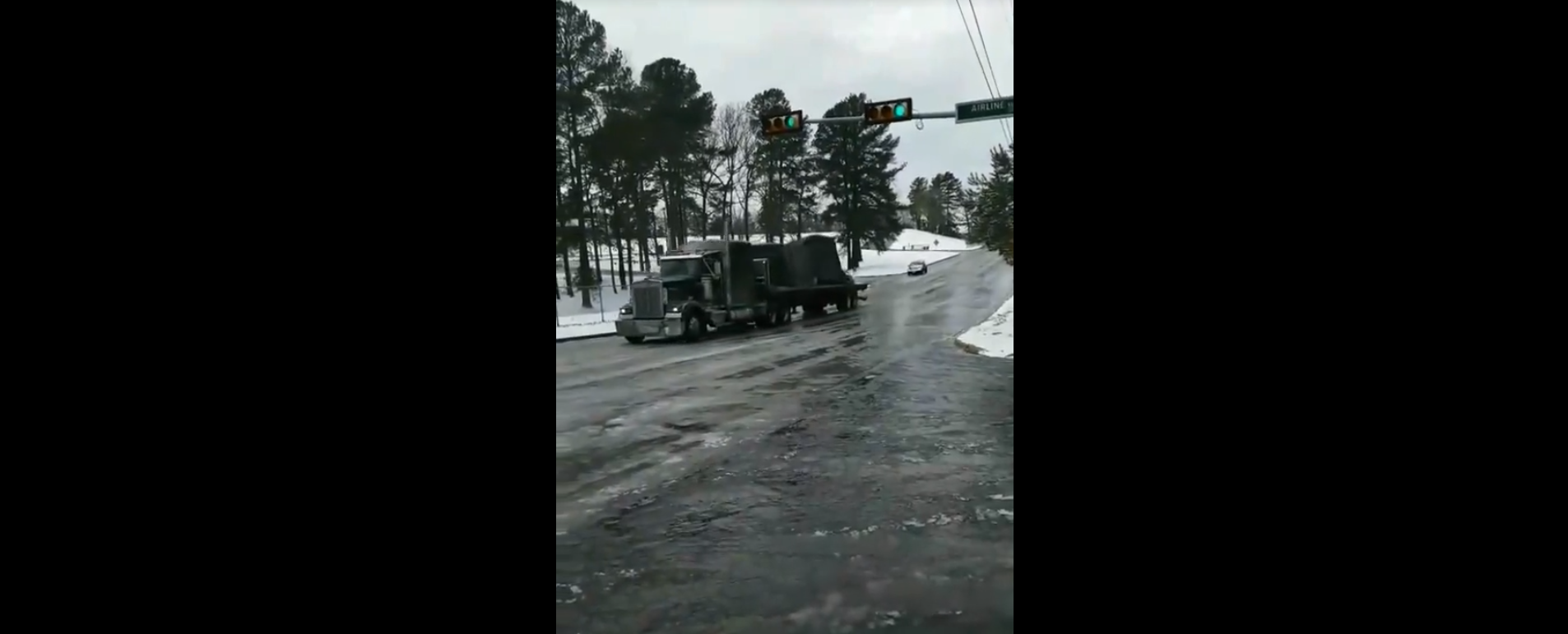 18-wheeler makes brave attempt to climb icy hill. It doesn't go well.