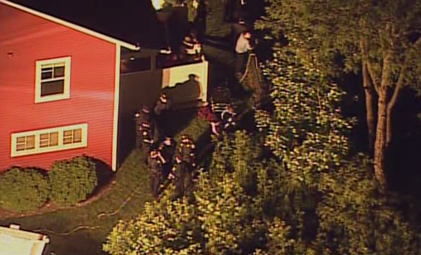 Police investigate suspicious death of 25-year-old woman found over hillside in Garfield