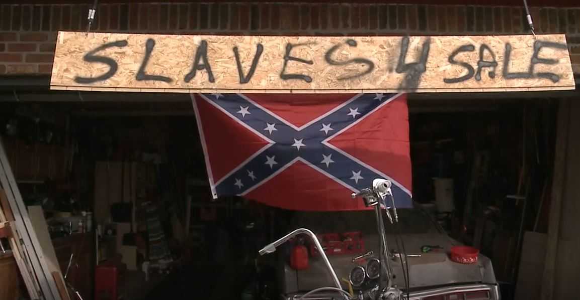 Man says he's not racist after hanging 'Slaves 4 Sale' sign outside home