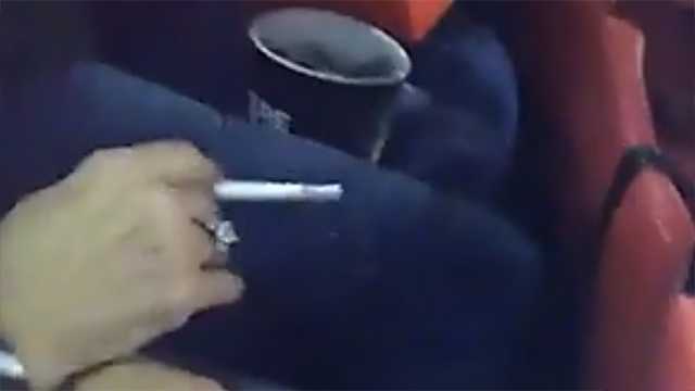 Police bodycam video shows Alabama fan being removed from stadium for smoking