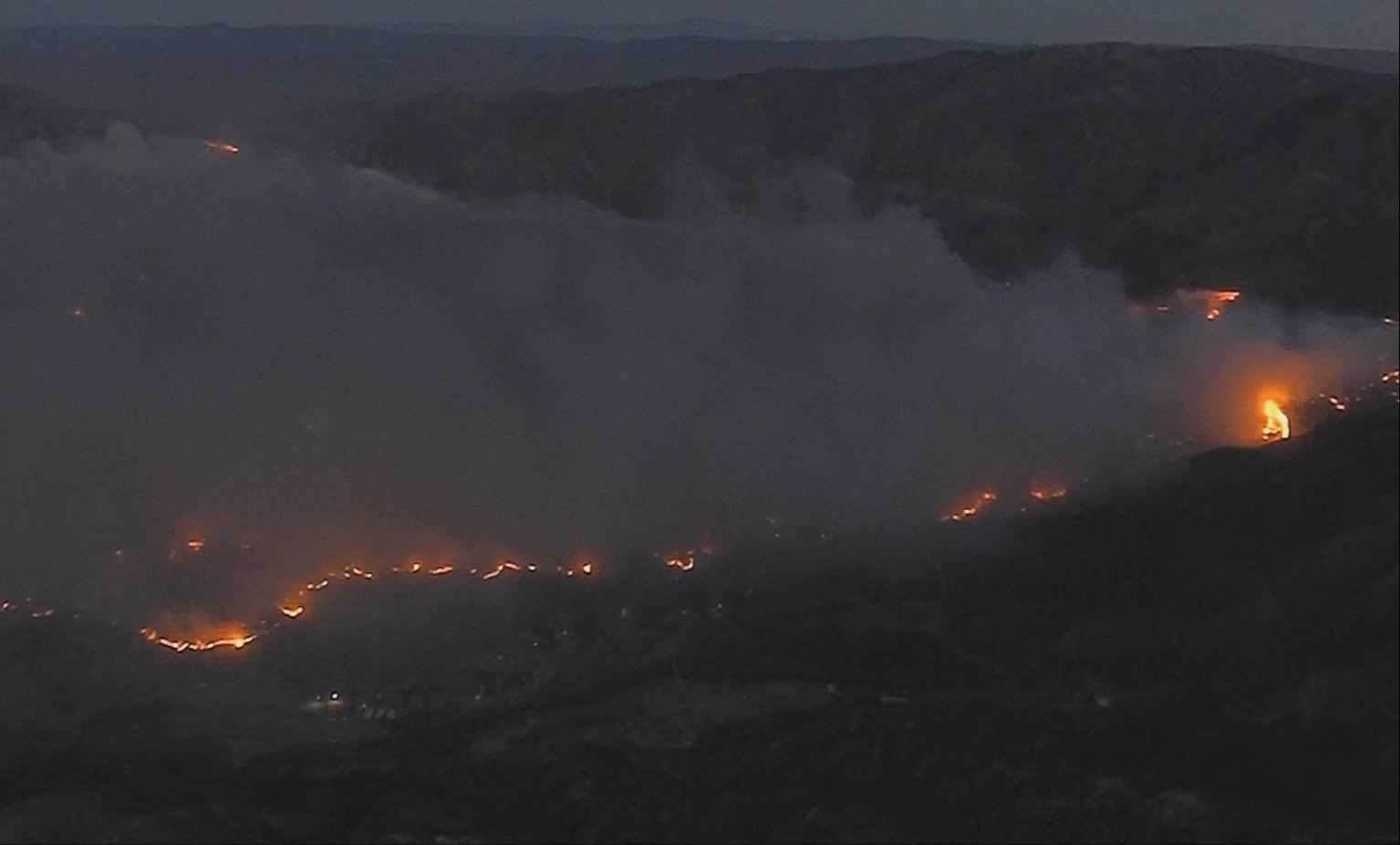 SoCal wildfire burns 150 structures; 27K people evacuated