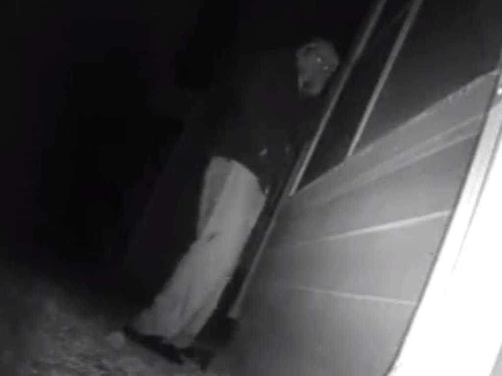 Woman catches hooded man looking into her home in terrifying video