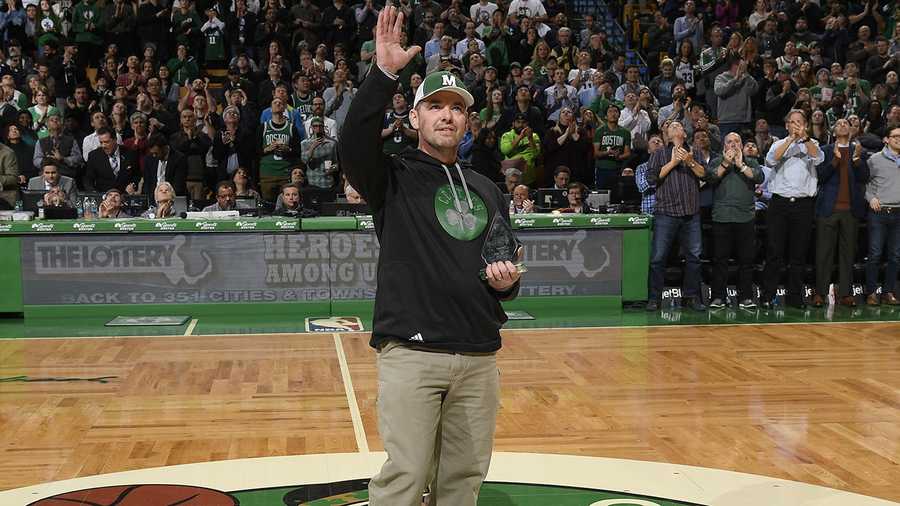 Lt. Steve Tenney of the Keene Police Department, accepts his Heroes Among Us award during the Boston Celtics game on February 26. Tenney was honored for his decision to donate a portion of his liver to an infant in need.