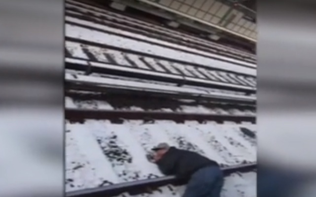 ‘Please wake up’: Commuters work together to save unconscious man on subway tracks