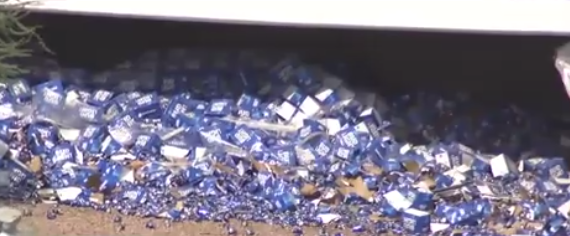Truck flips, spills thousands of cans of beer on Arizona freeway