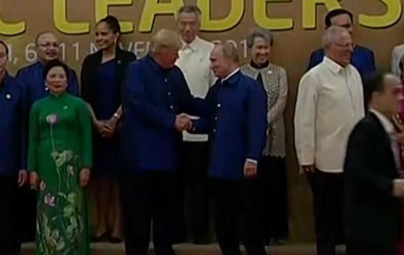 Trump, Putin shake hands but no formal meeting expected