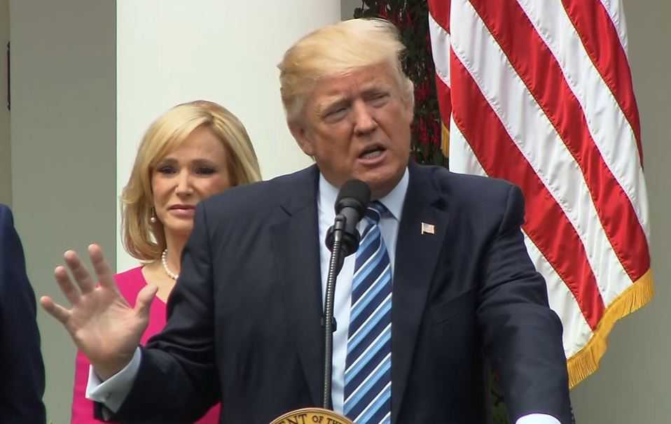 Justice Department to ask Supreme Court to review blocking Trump's travel ban