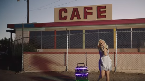 Pop star, country group film music video in New Mexico