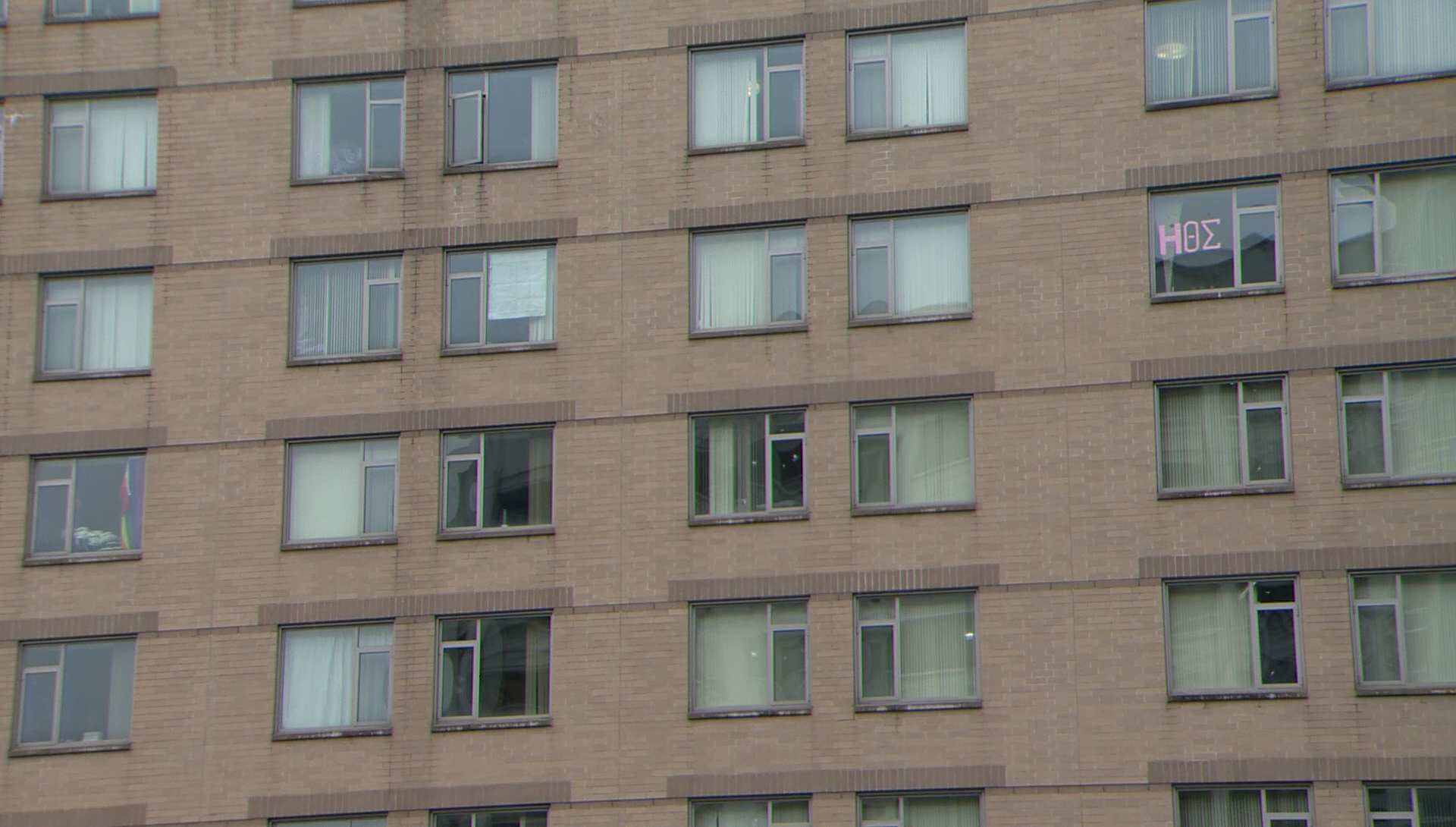 Man charged with using spotting scope to peep in to dorm