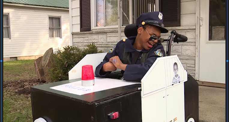 Boy transforms wheelchair into cop car for Halloween
