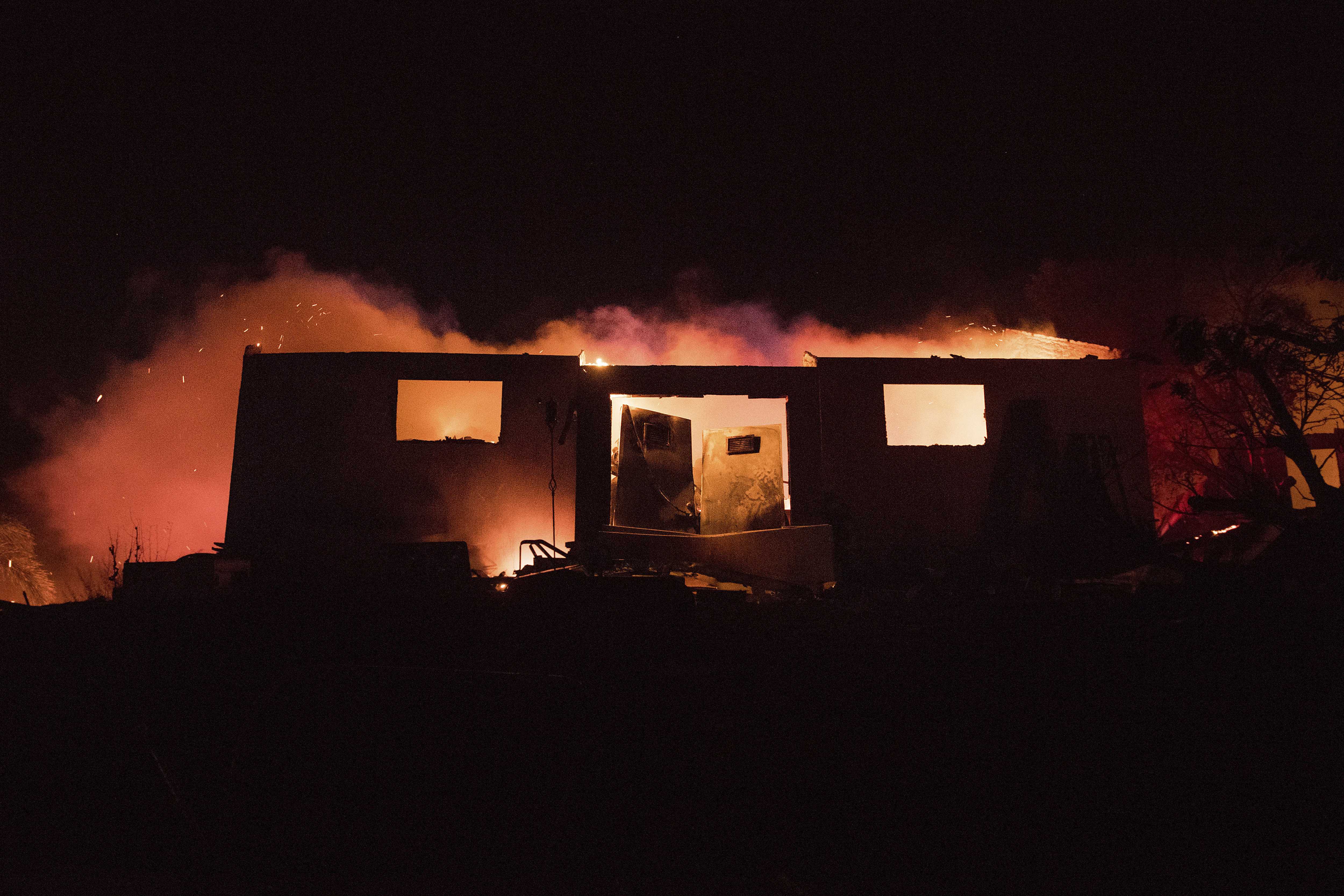 Fires stretch across wide swath of Southern California as Trump declares emergency