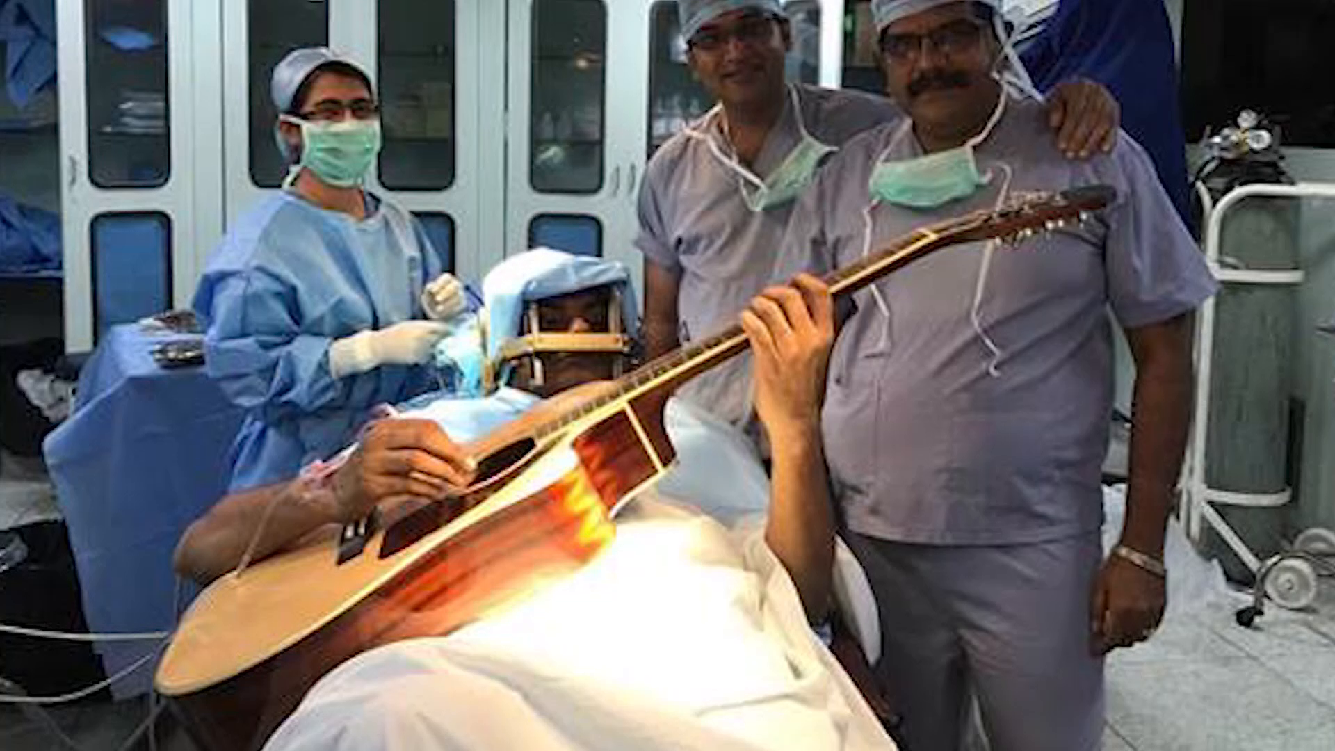 This musician strummed a guitar during his own brain surgery