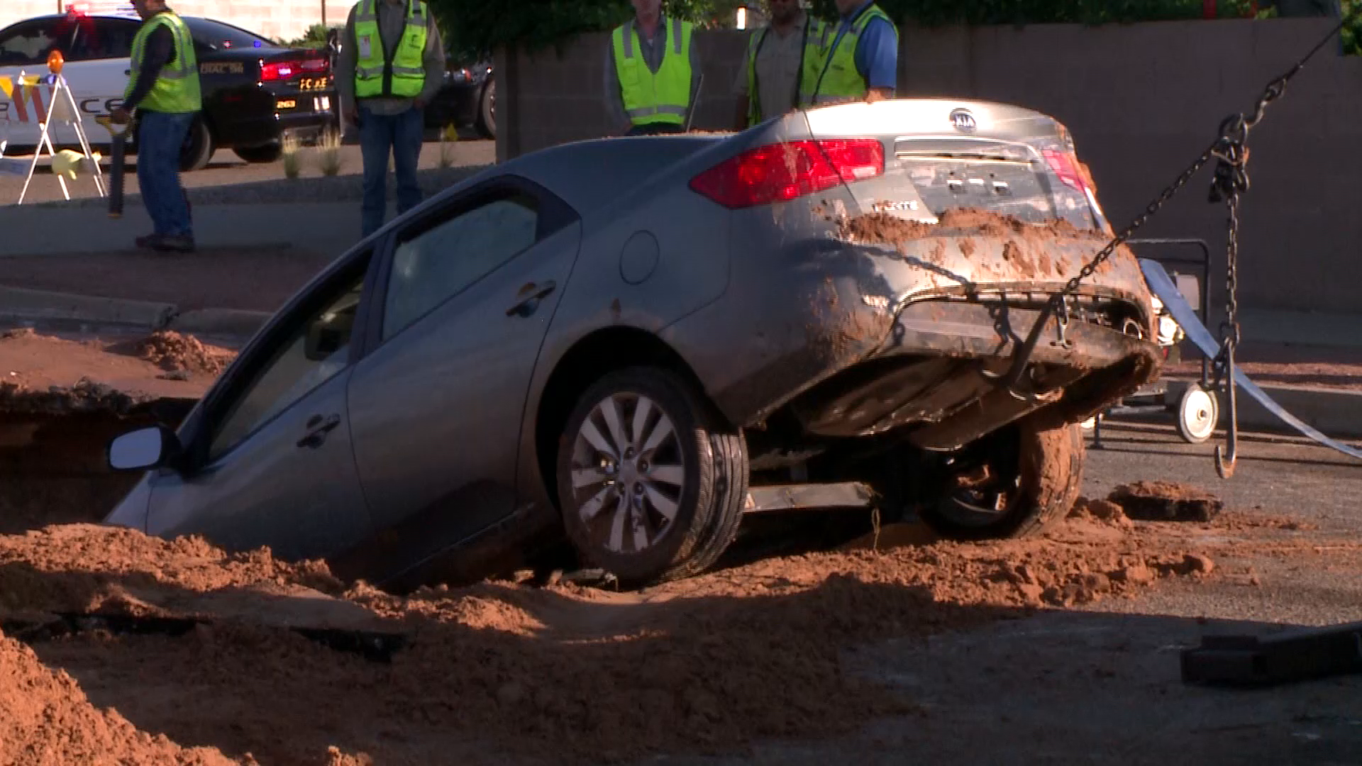 Crews remove vehicle from sinkhole