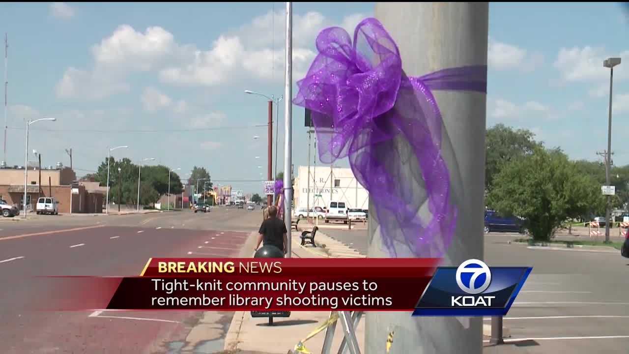 Tight-knit community pauses to remember library shooting victims