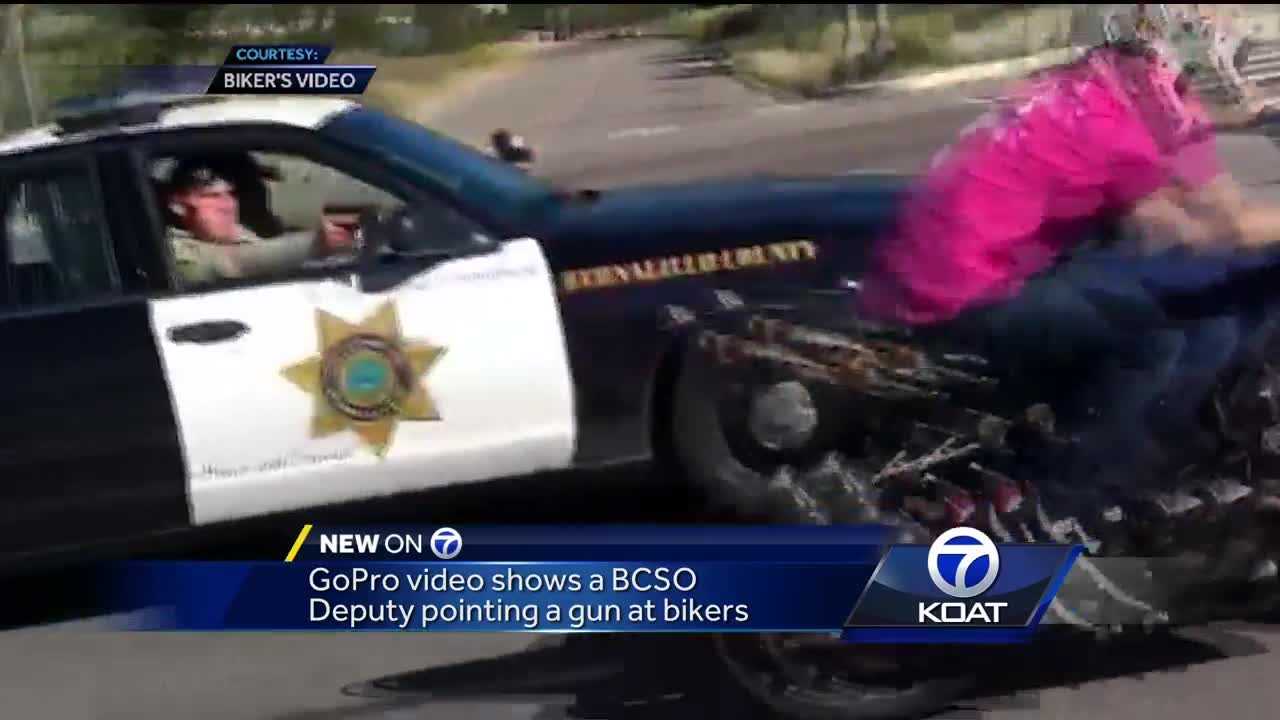 Deputy points gun at motorcyclists