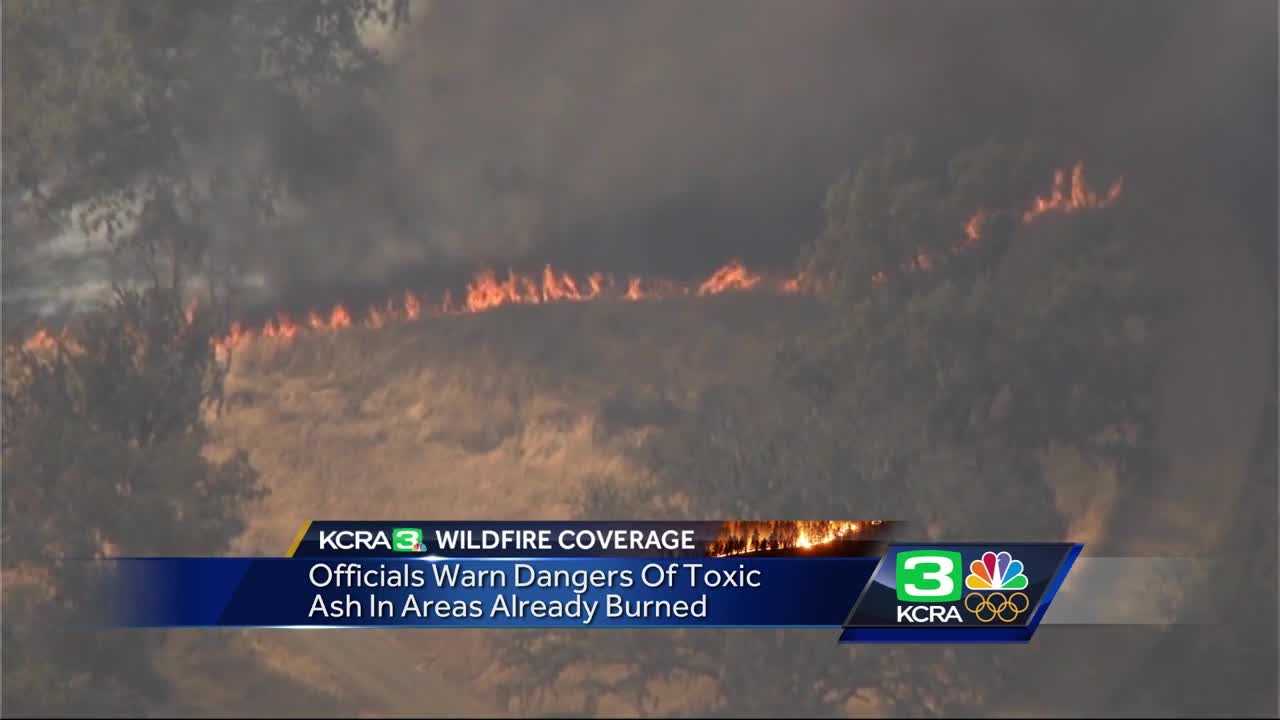 Officials warn of toxic ashes in wildfire zones