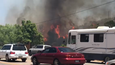 Fire rapidly burning in Tijeras