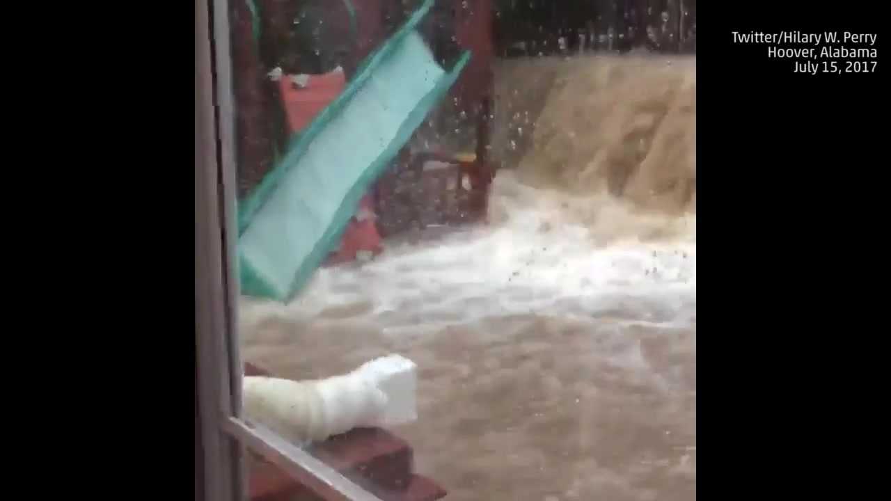 Massive downpour creates waterfall in backyard