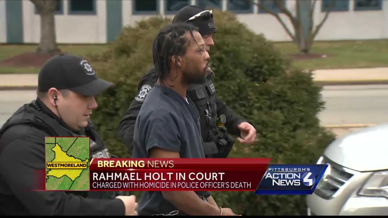 Rahmael Holt in court, charged with homicide in officer's death