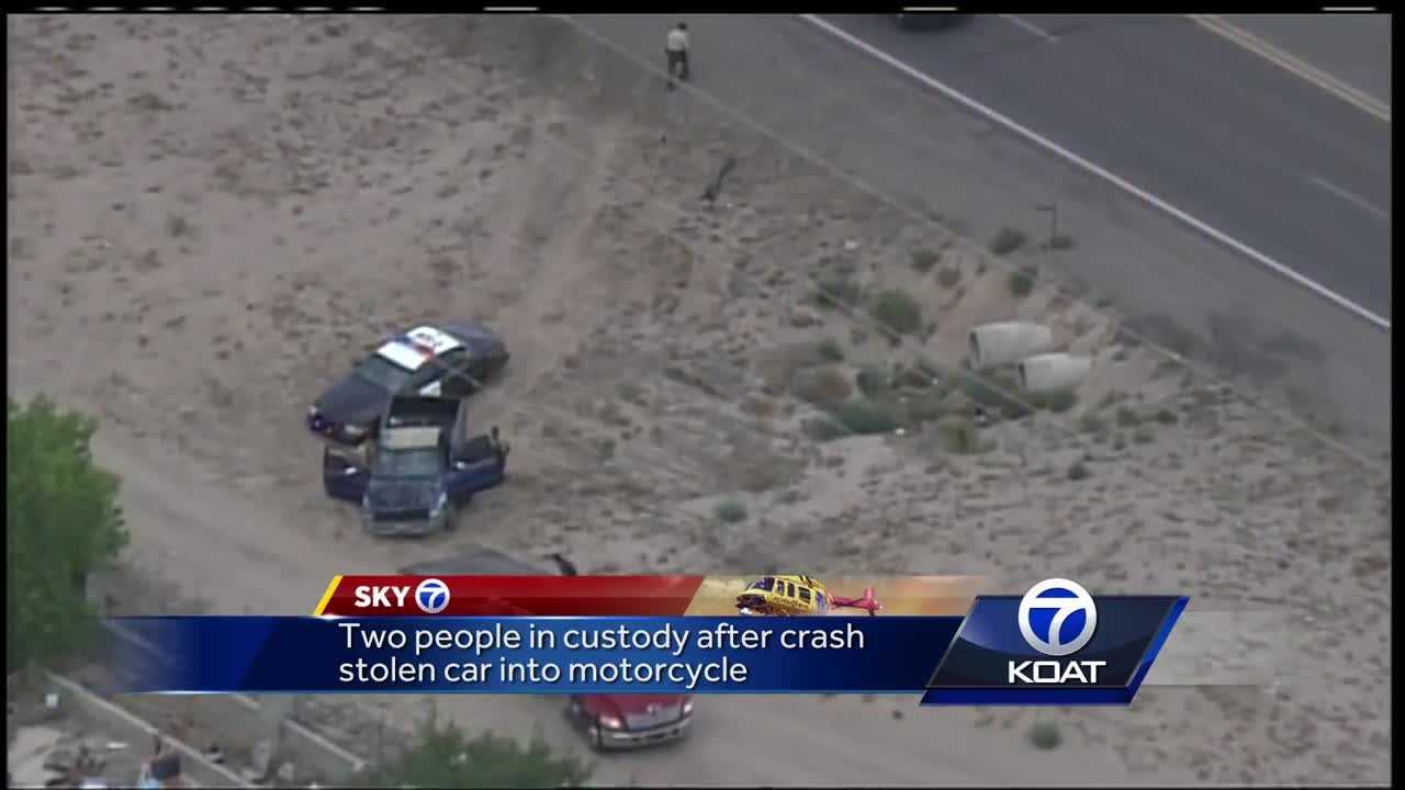 Two people in custody after crashing stolen vehicle into motorcycle