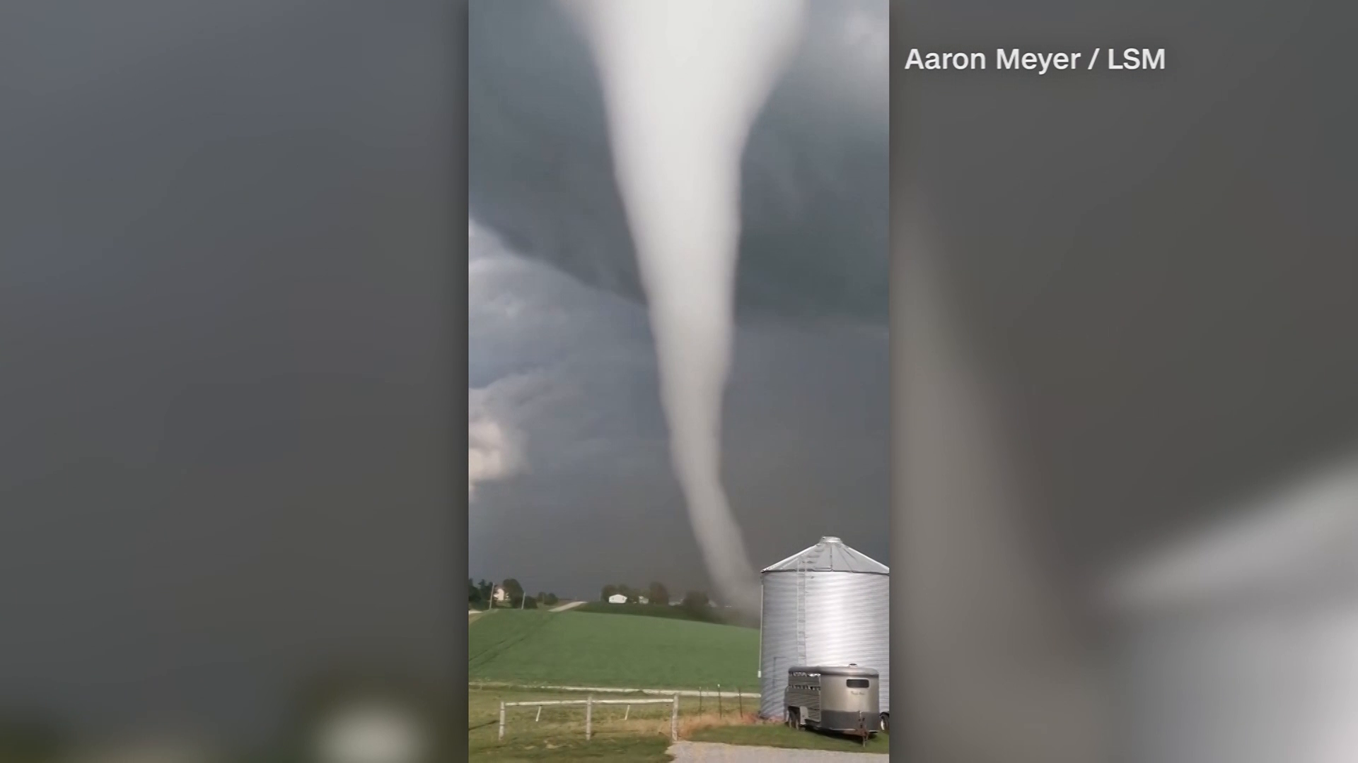 Tornado caught on camera touching down, rolling through fields