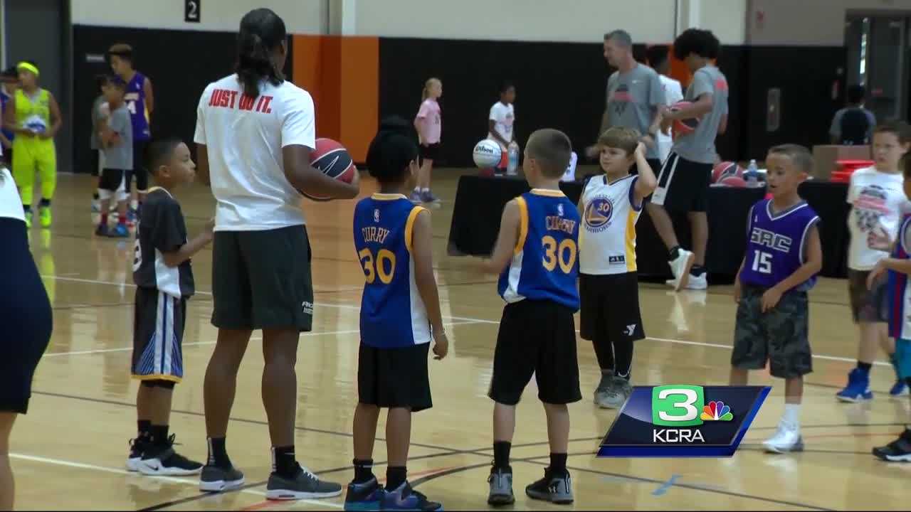 Young basketball players learn team skills at Stockton camp