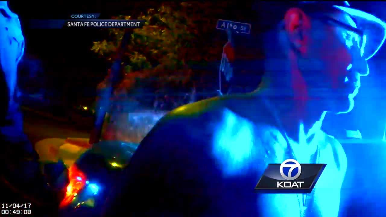 Father charged with firing gun out of moving car