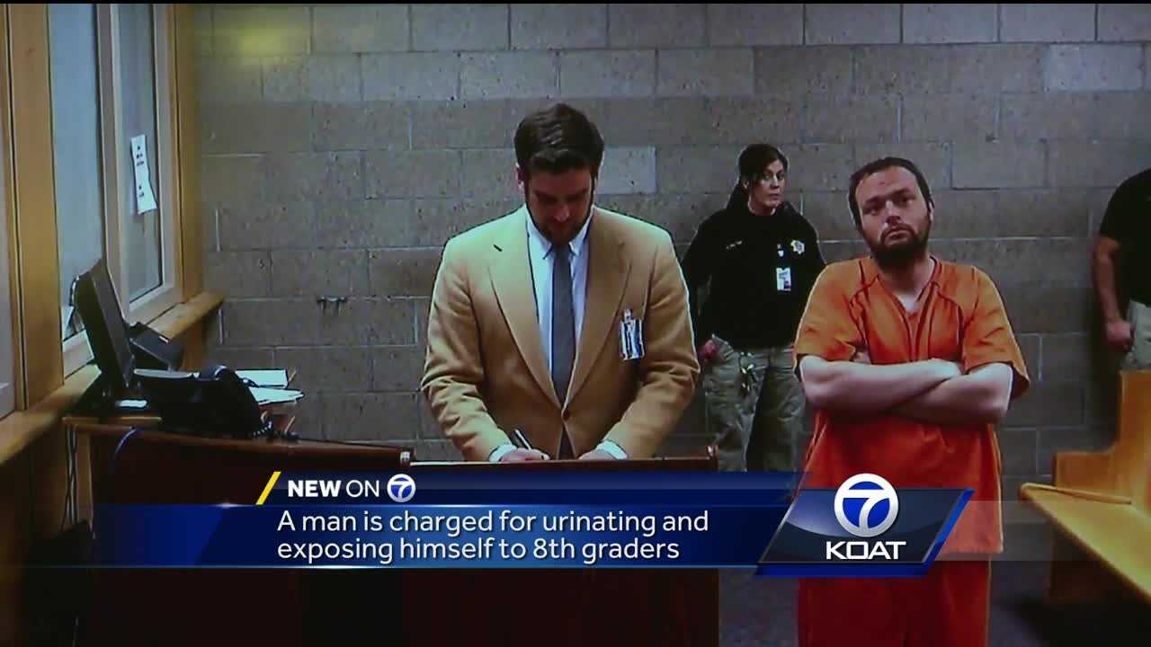 Man charged for urinating, exposing himself to students