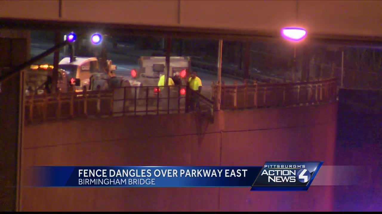 Fence dangles over Parkway East, forcing police to stop traffic