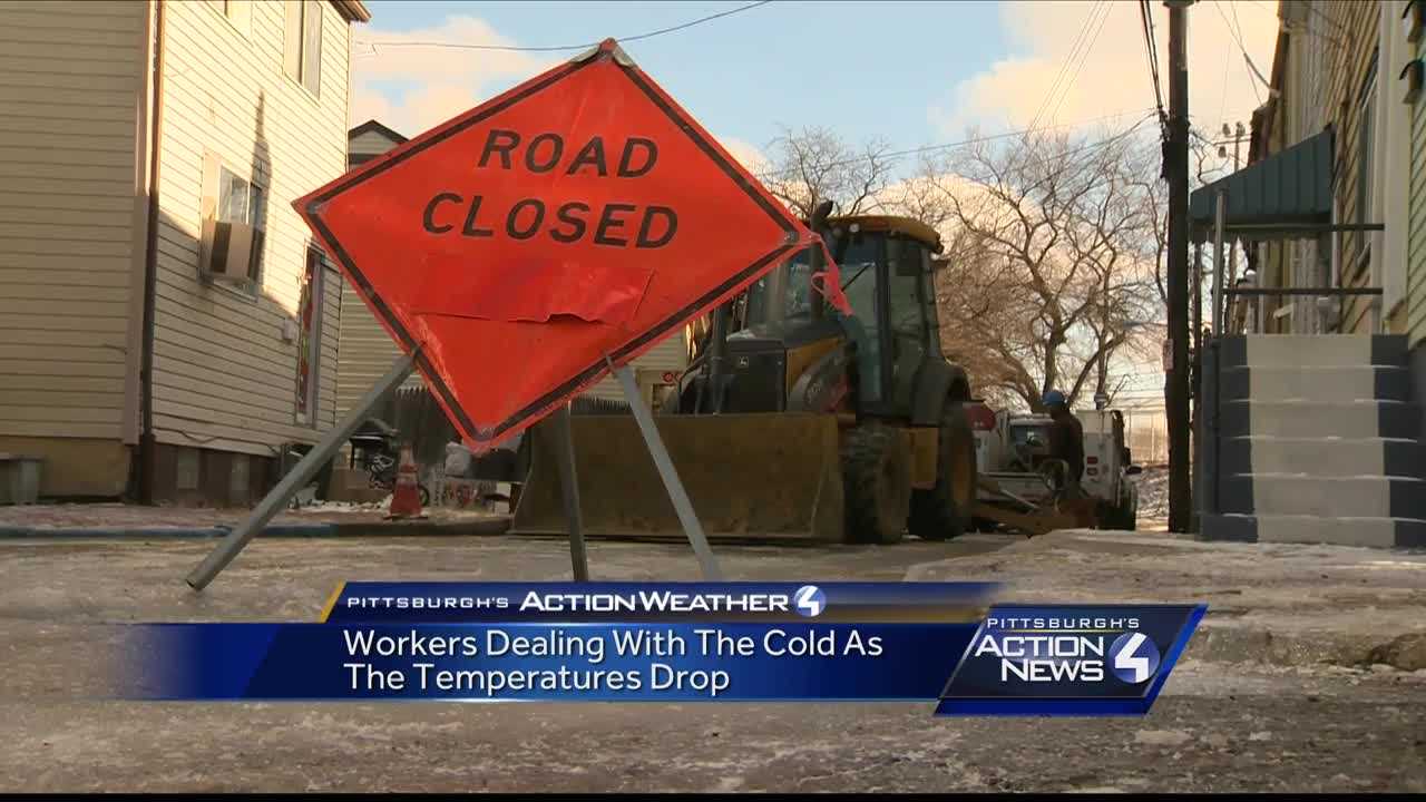 Workers dealing with the cold as the temperatures drop
