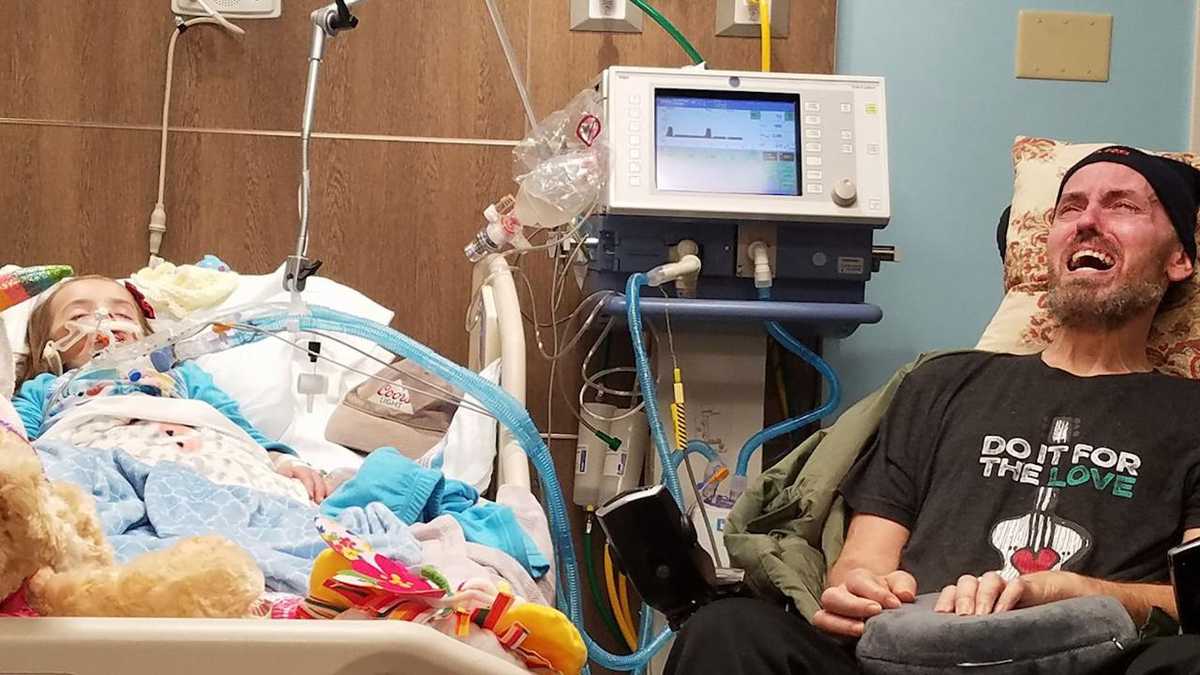 Tragic photo of grandfather at bedside of dying girl shows brutality of cancer
