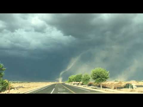 Funnel cloud touches down amidst storm