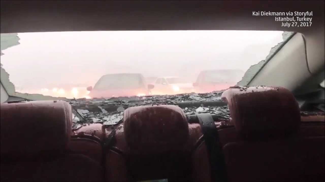 Huge balls of hail destroy car windows
