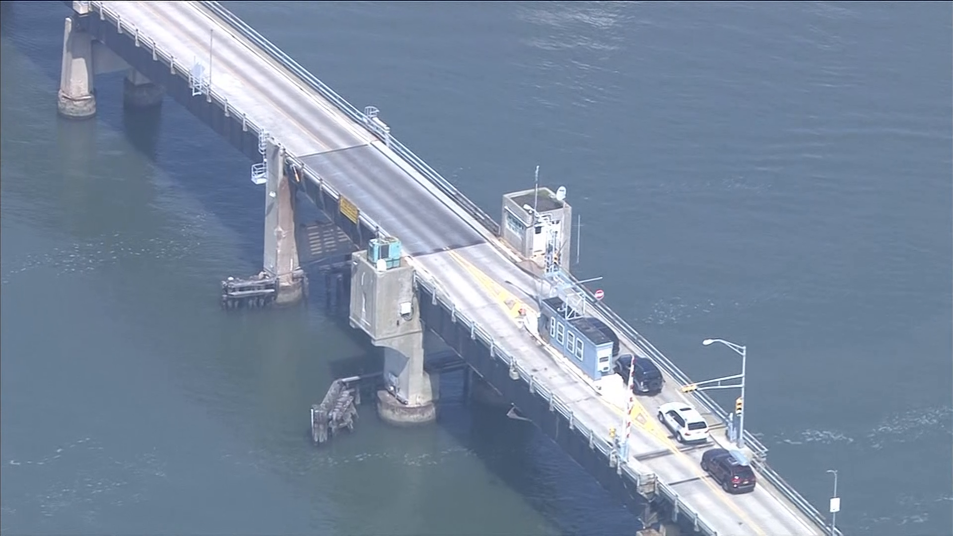 Terrified family forced to jump gap after getting stuck on rising drawbridge