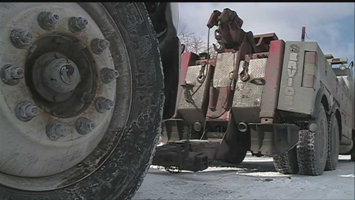 Tow trucks clear cars off snowy Omaha roads