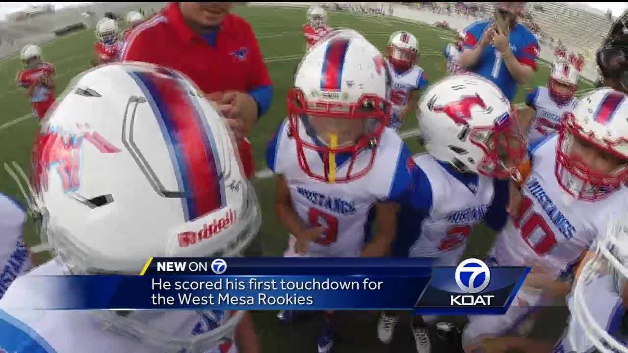 Boy battling cancer runs to the end zone