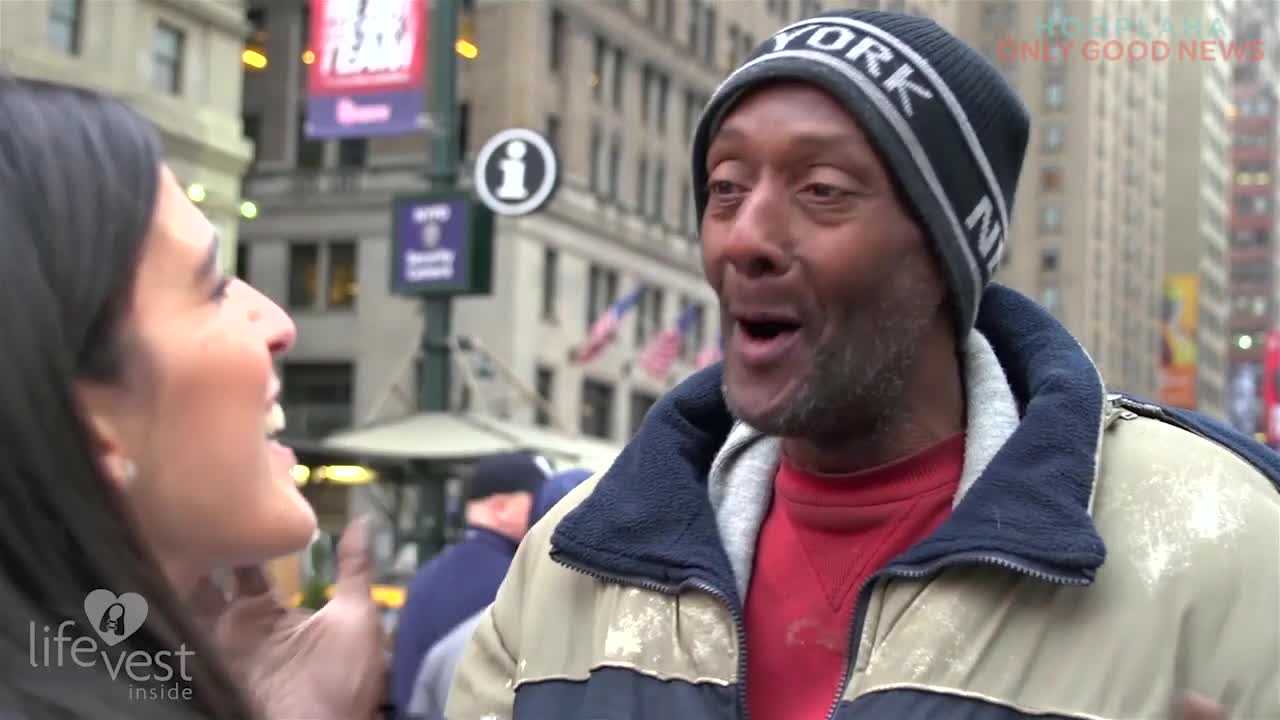 Woman hands out care packages to the homeless