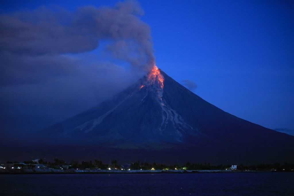 Incredible images show lava, ash spewing from Philippine volcano