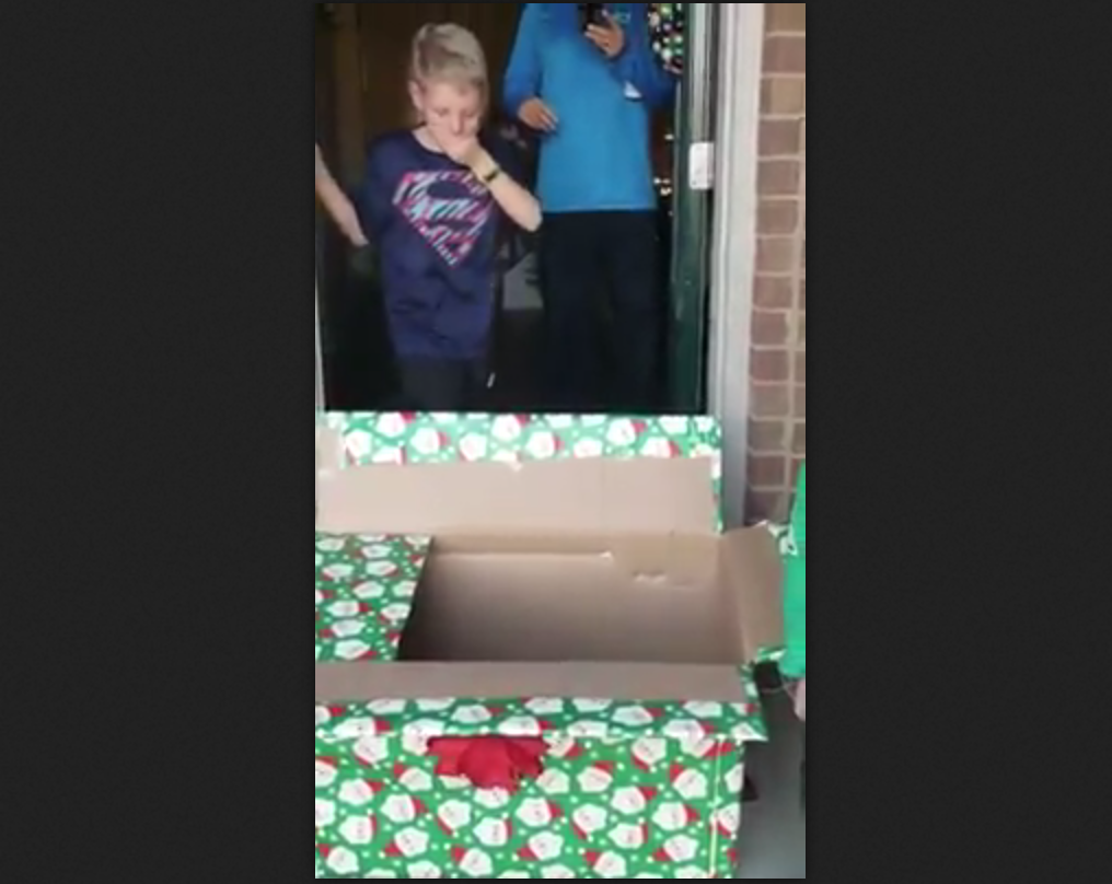 See the heartwarming moment a young boy discovers his four-legged Christmas present