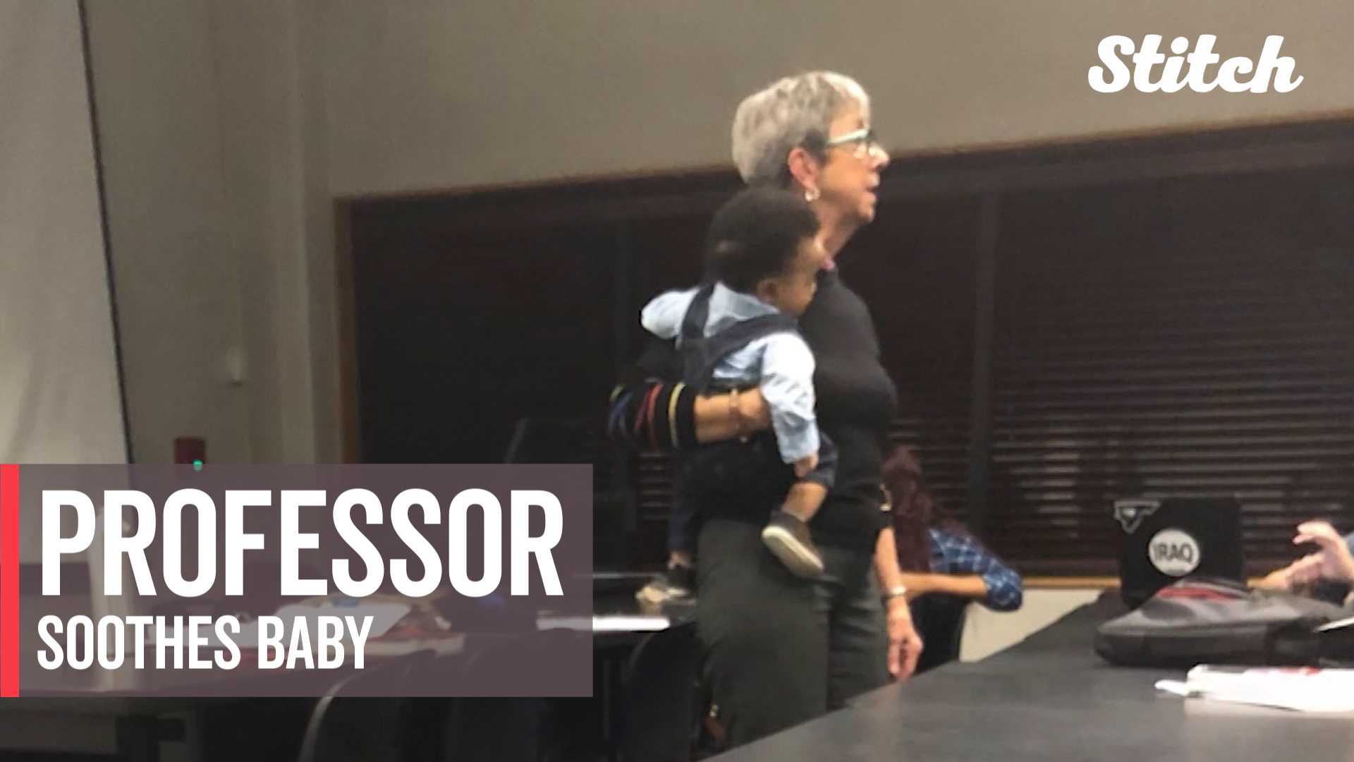 College professor helps student mother by soothing her baby during class